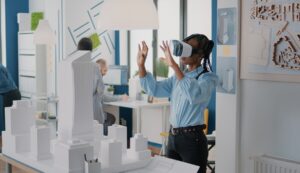 Architect using vr glasses to design building model and construction layout
